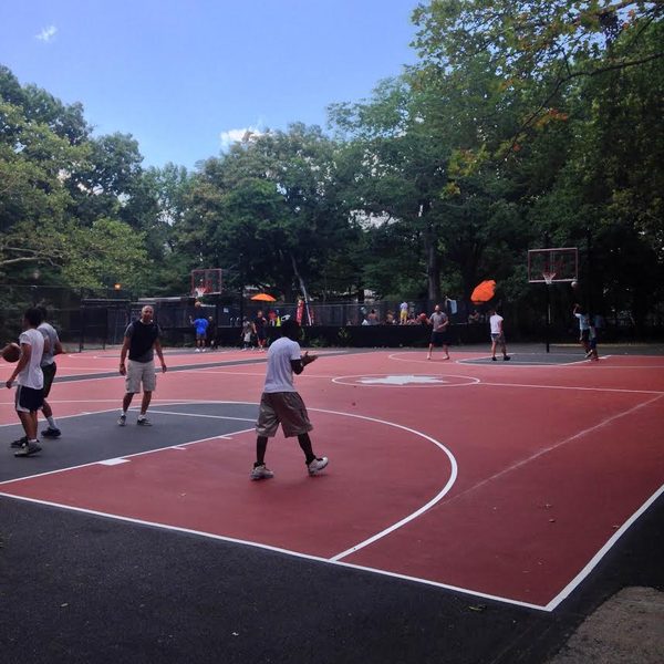 A pickup game on the basketball courts in summer